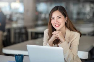 Businesswoman on laptop working in internal communications