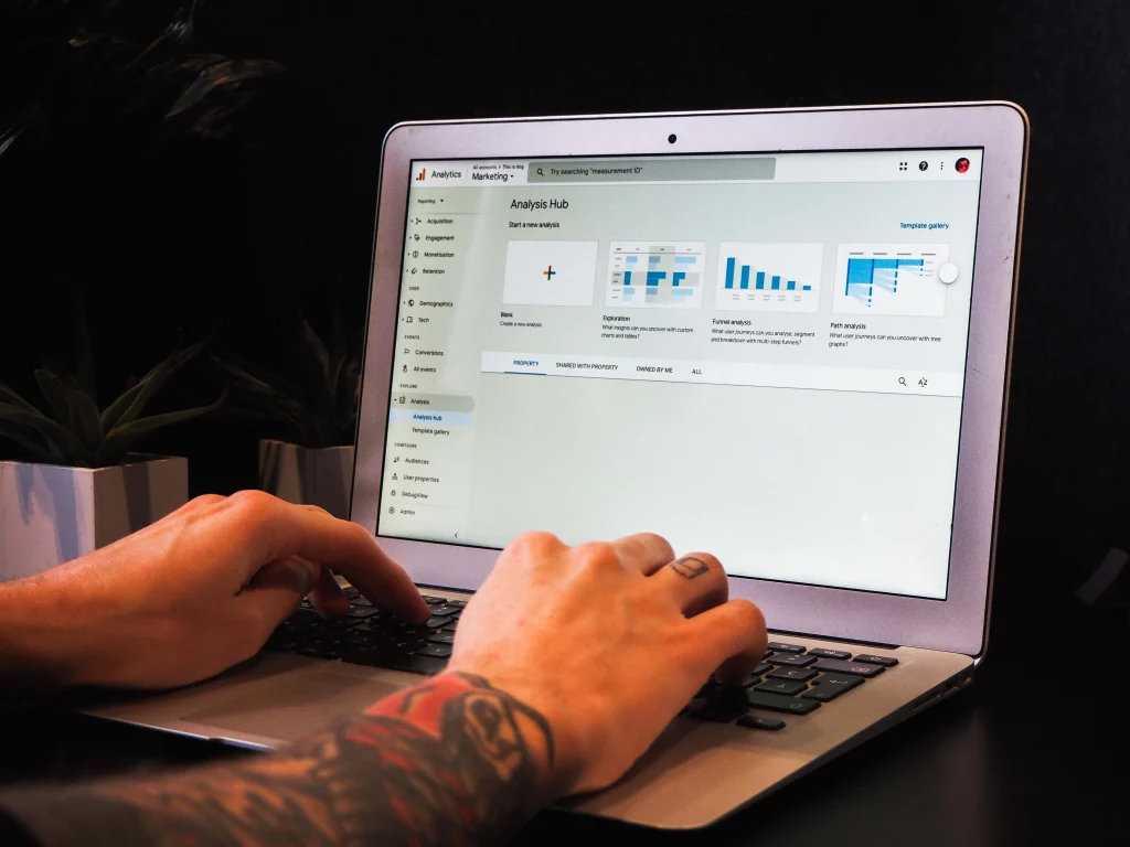Digital content specialist checking Google Analytics reports on their laptop